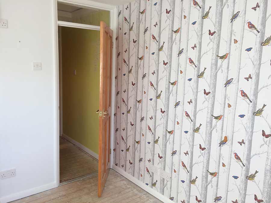 Painting and wallpaper in bedroom